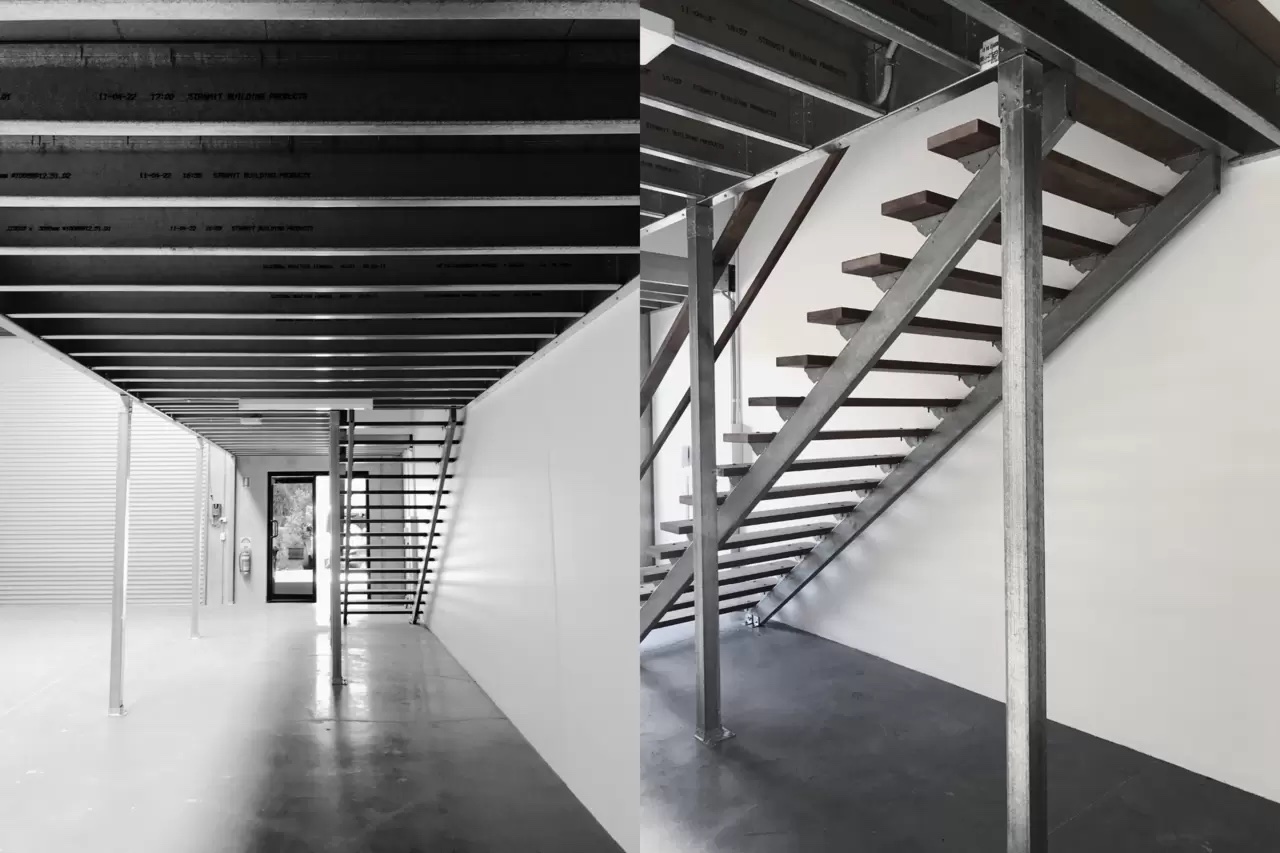 Elevated steel deck frame with staircase